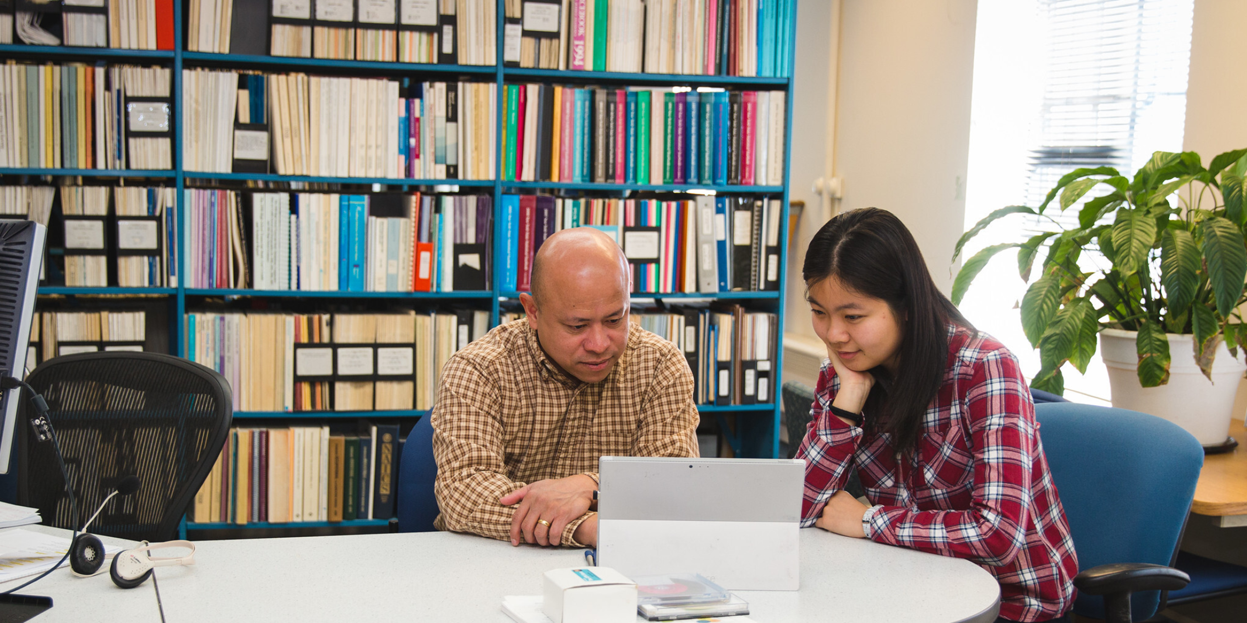 Image of two people having consultation in an office