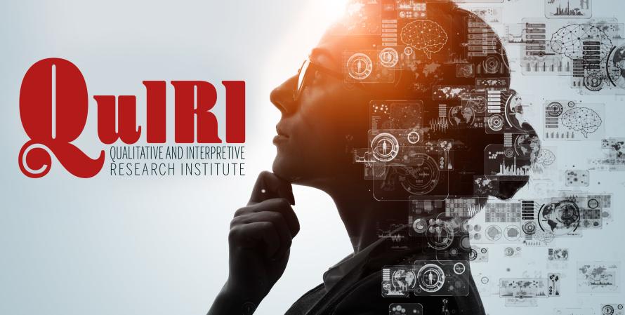 Woman researcher gazing up towards QuIRI logo